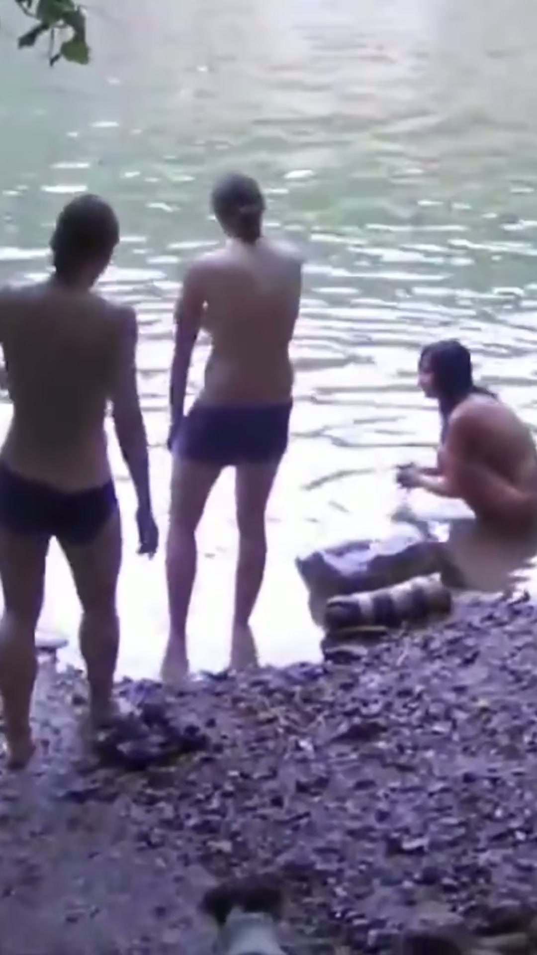 A cute, petite Asian woman hikes the mountains completely naked. Tourists don't bother her. She swims in the river, climbs trees, and walks along trails.