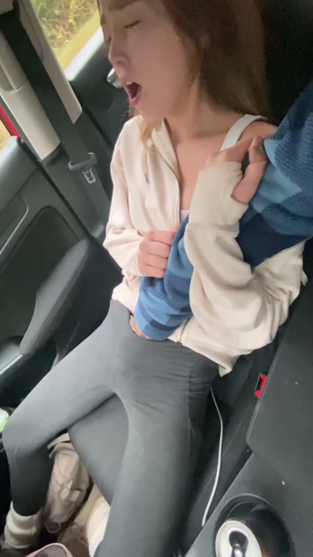 In a parked car, He fingers me until I my orgasm squirts, gushing in my leggings all over his hand.