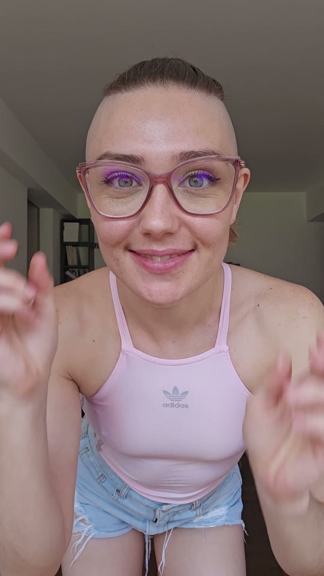 The glasses change everything; they look great with this look.