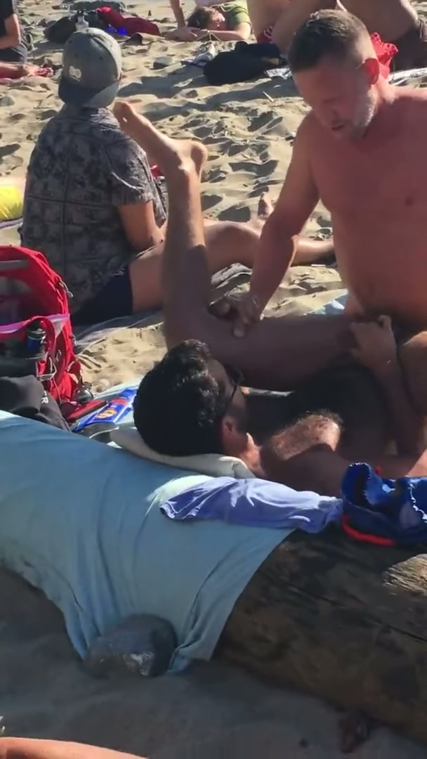 Very public beach banging.